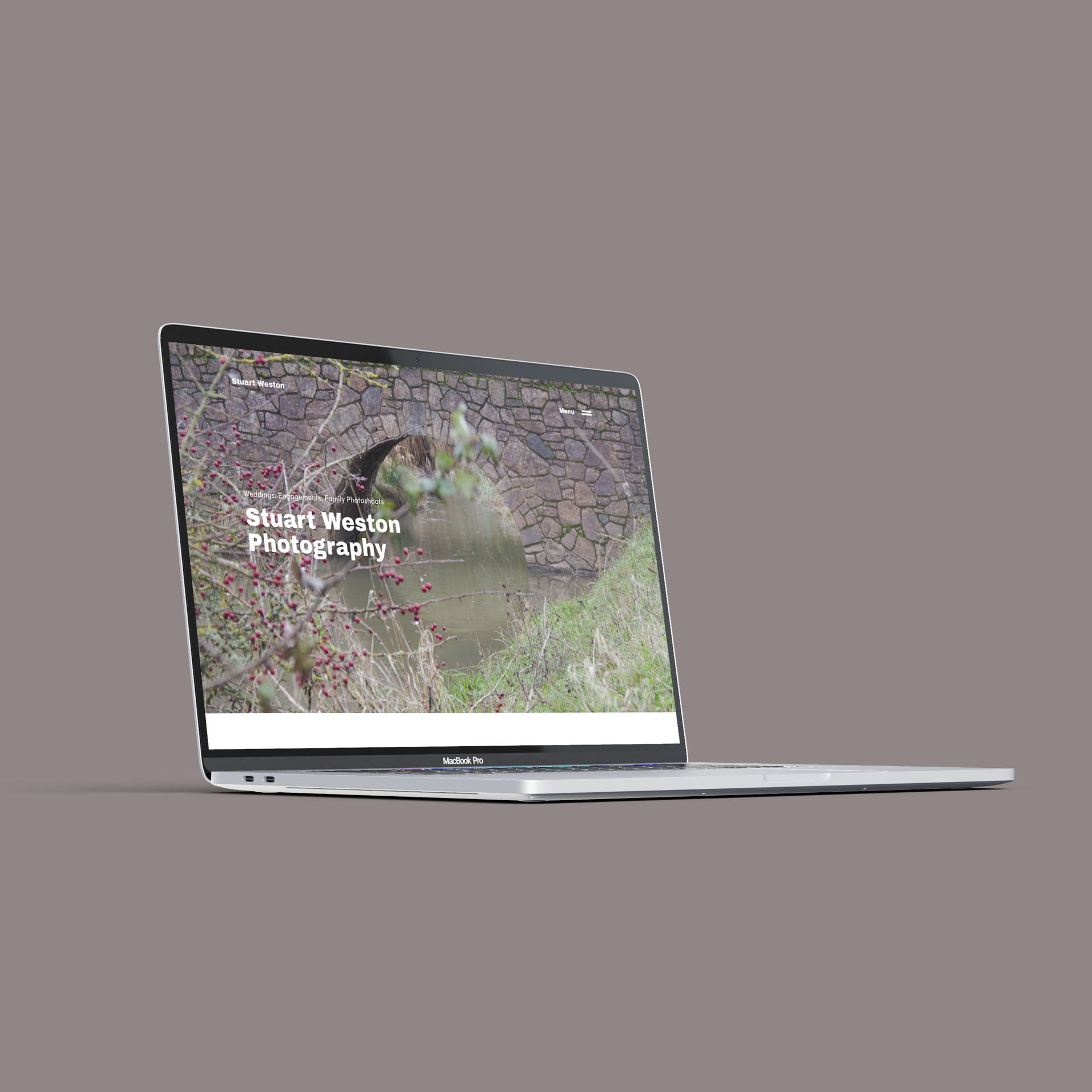 Mockup of a MackBook showing the homepage of the Stuart Weston Photography website